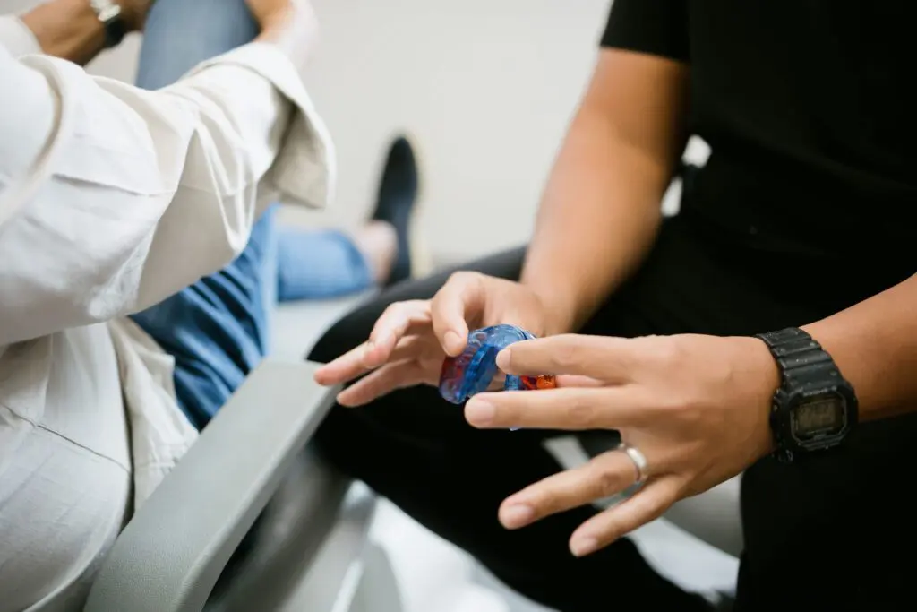 a person holding a plastic ring