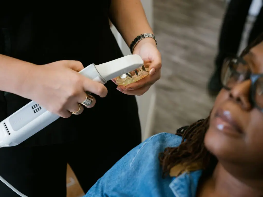 a woman getting a dental treatment