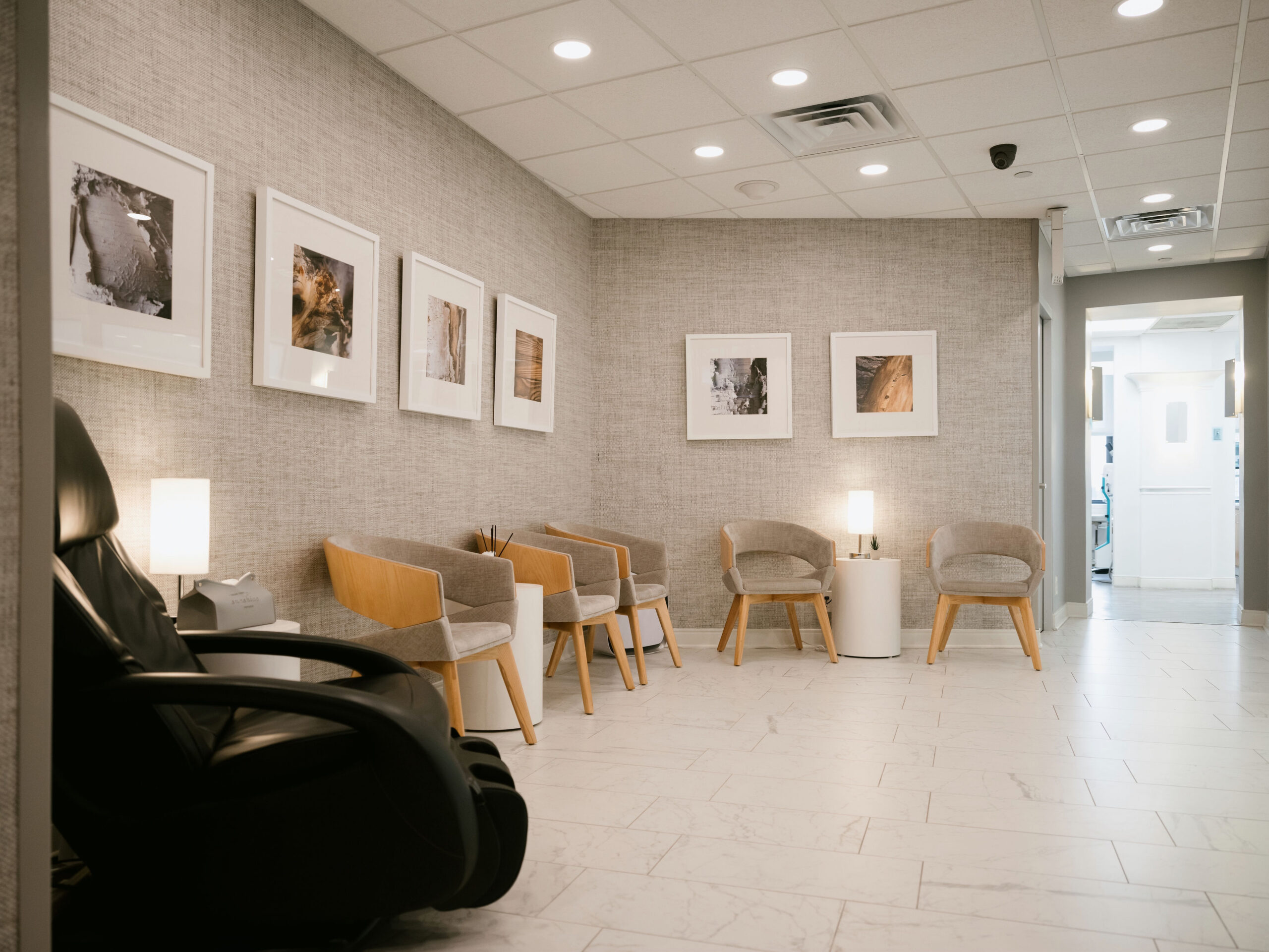 a room with chairs and a lamp