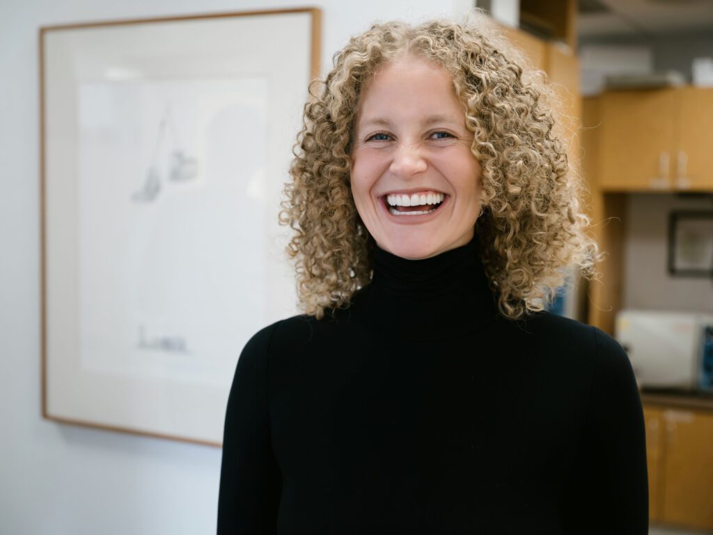 a woman smiling at camera