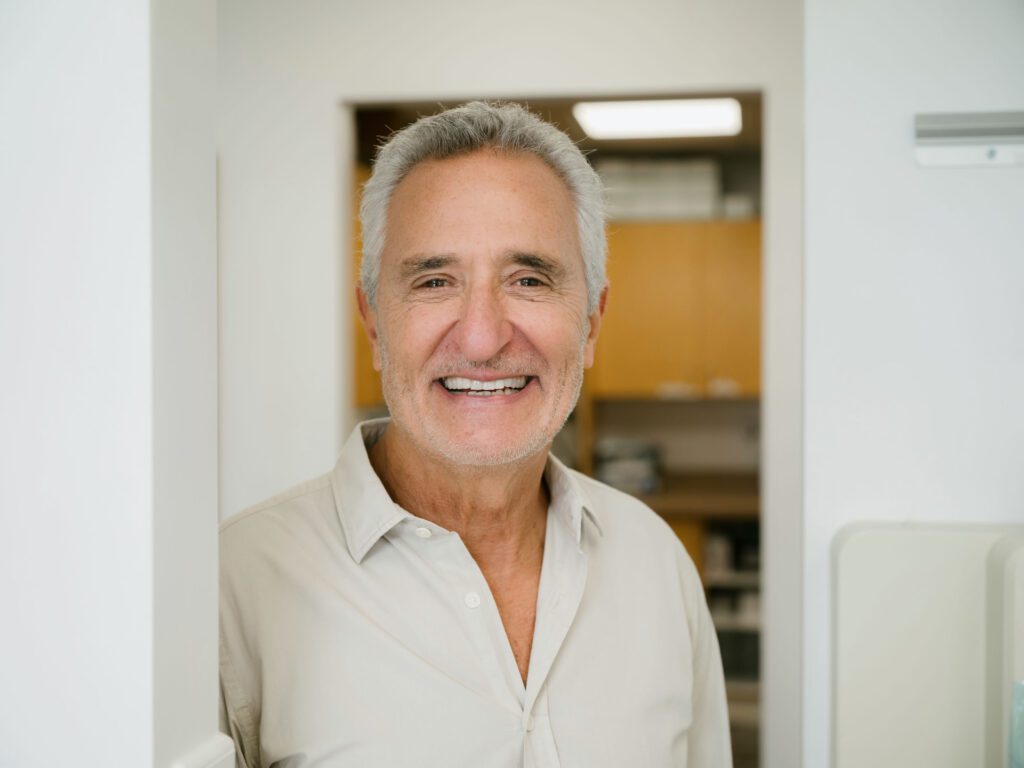 a man smiling at camera
