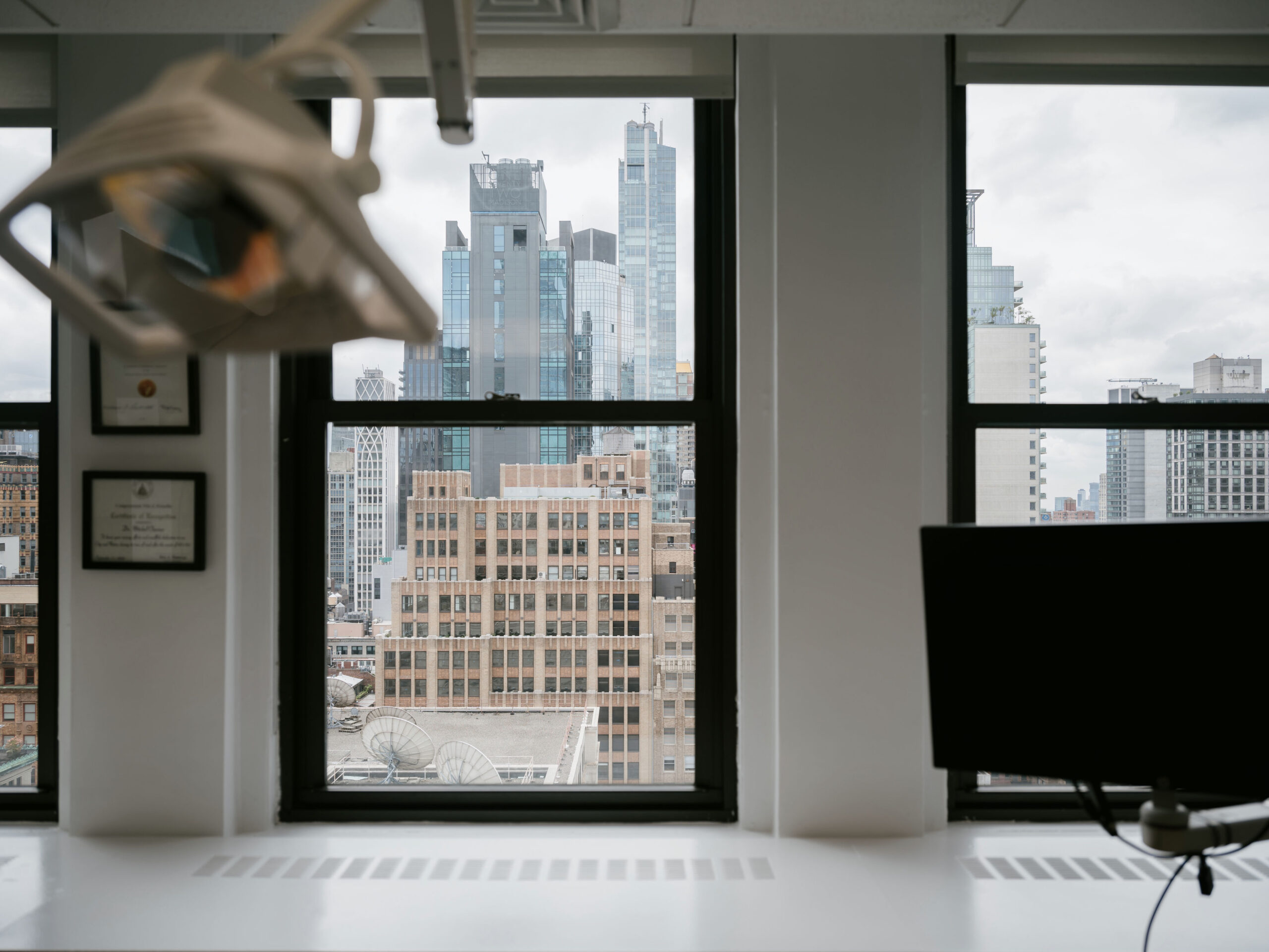 a view of New York city from a window at Manhattan Dental Spa