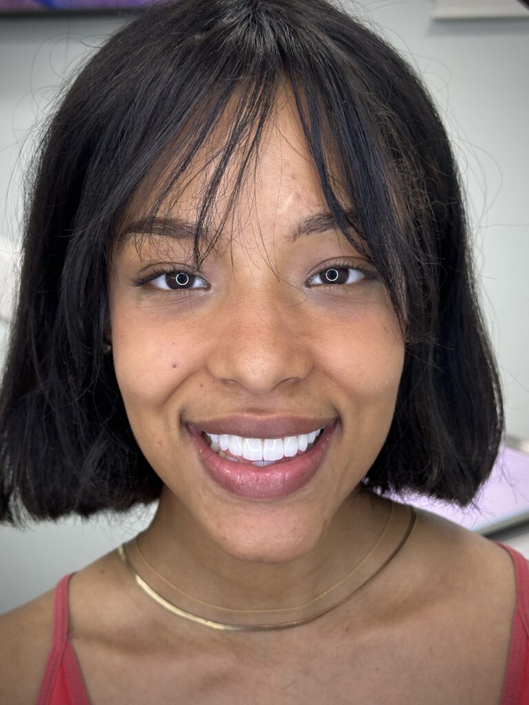 a woman smiling at the camera