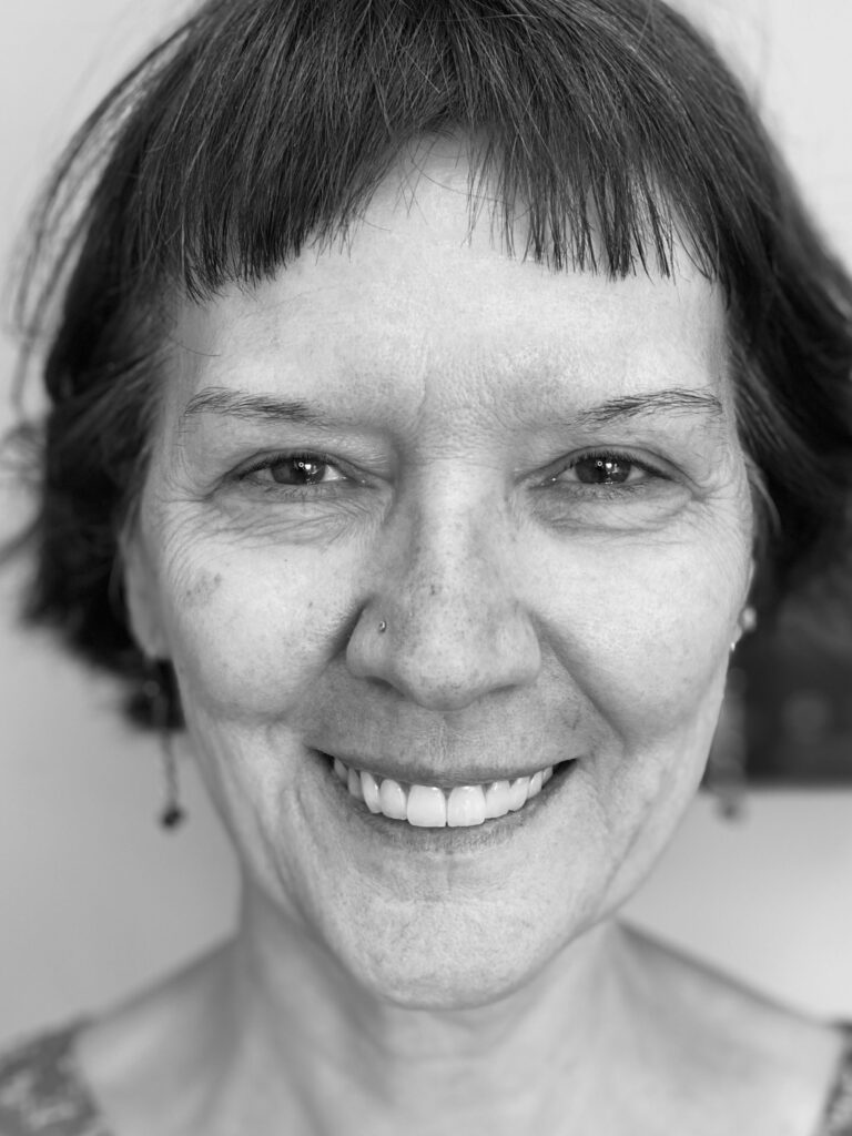 a woman smiling at the camera
